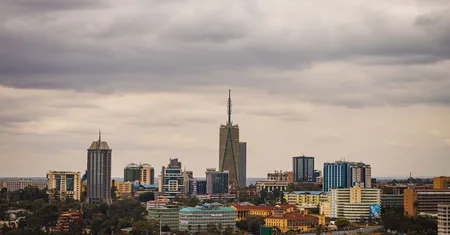 Skyline of an African city with modern skyscrapers under an overcast sky
