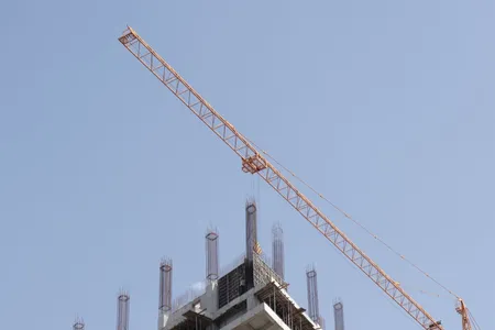 Construction crane on a development site representing infrastructure financing in emerging markets